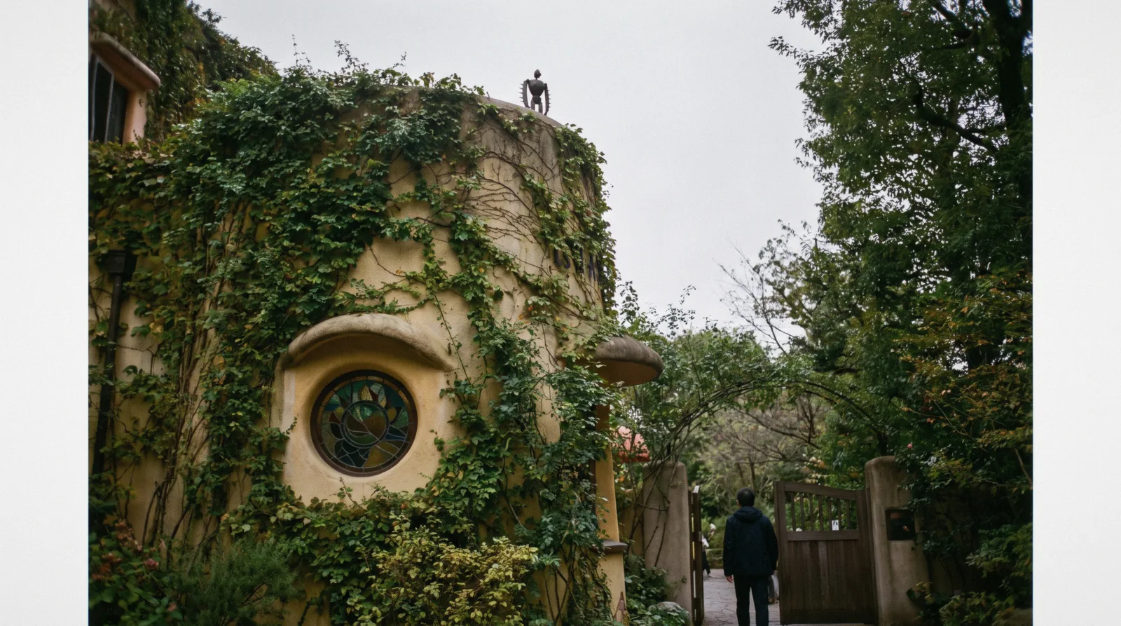Stained glass and the ivy-covered facade of the Ghibli Museum in Mitaka on a bright morning, Ghibli Museum Tokyo
