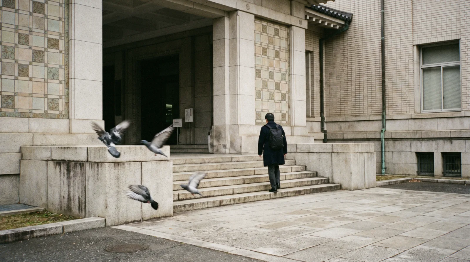 The 1938 Honkan gallery with its tiled Japanese roof seen across the forecourt fountain at the Tokyo National Museum, Taito, Tokyo