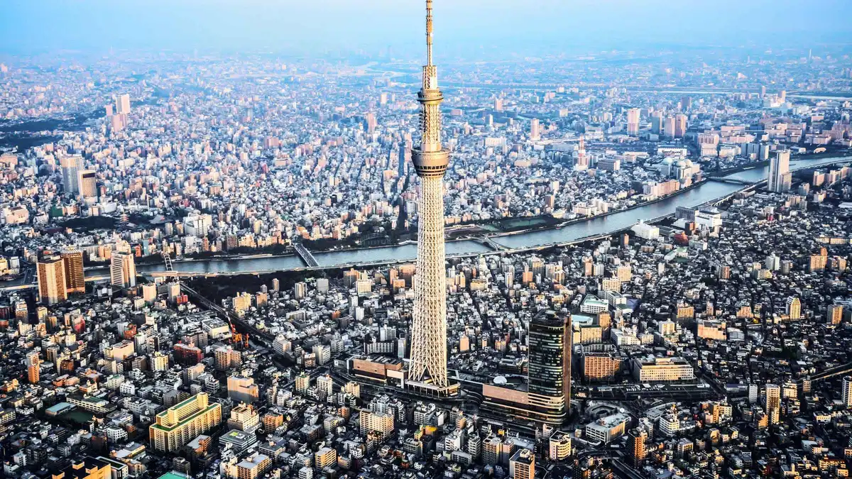 Visitors admiring the 360-degree skyline view from the Tembo Deck at Tokyo Skytree, Tokyo Japan