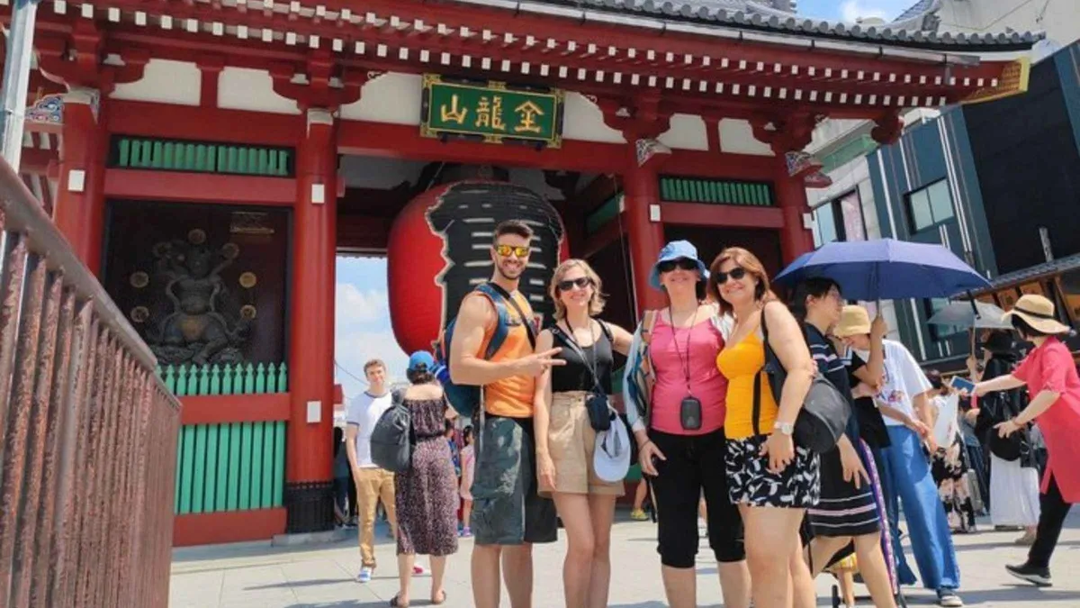 Local guide pointing out a Tokyo landmark to travelers during a private customizable walking tour, Tokyo Japan