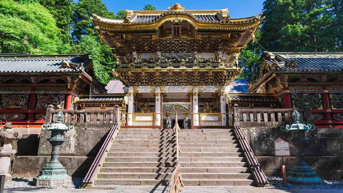 Shinkyo Bridge and the Toshogu shrine complex seen on a guided Nikko tour from Tokyo, Nikko Japan