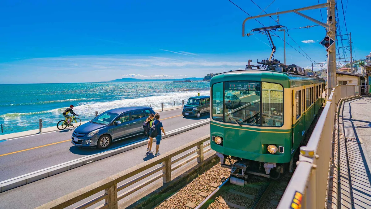 Enoden train arriving at Enoshima Island on a combined Enoshima, Kamakura or Yokohama day tour from Tokyo, Enoshima Japan